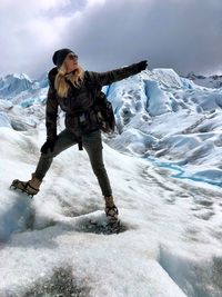 Woman standing on glacier 