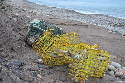 High angle view of fishing net on shore