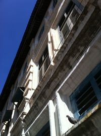 Low angle view of buildings against clear sky