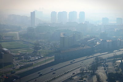 High angle view of buildings in city against sky