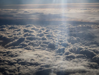 Aerial view of sea against sky during sunset