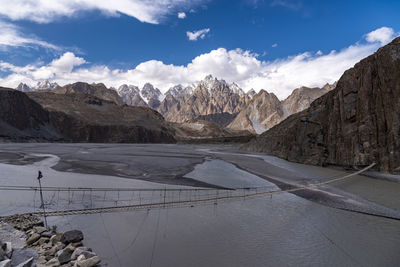 Scenic view of mountains against cloudy sky