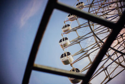 Low angle view of ferris wheel against clear sky