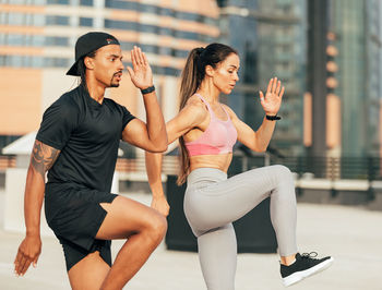 Young woman exercising in gym