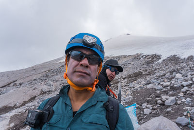 Man standing on snow covered mountain