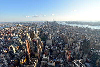 High angle view of city buildings against sky