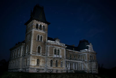 Low angle view of historic building against sky at night