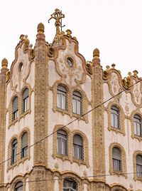 Low angle view of old building against clear sky