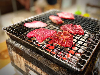 Close-up of meat on barbecue grill