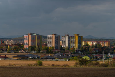 Buildings in city against sky