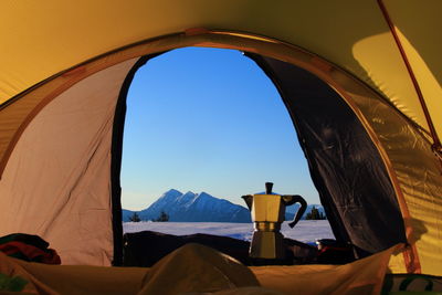 Close-up of tent against clear sky during winter