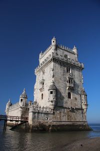 Low angle view of building against blue sky