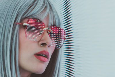 Close-up portrait of woman wearing sunglasses