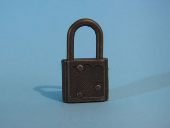 Close-up of padlocks against white background