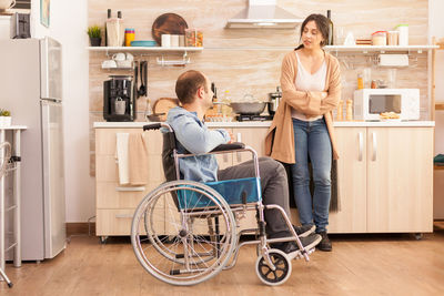 Man and woman standing at table