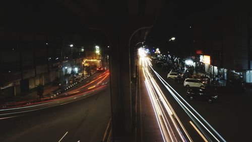 High angle view of light trails on road at night