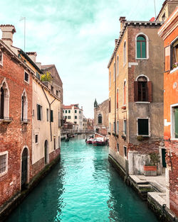 Canal amidst buildings in venice