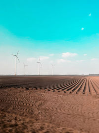 Low angle view of beach against blue sky