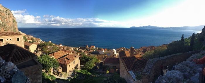 High angle view of sea and buildings against sky