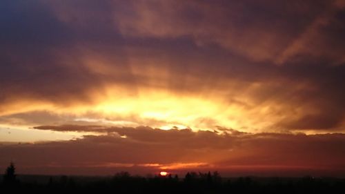 Scenic view of dramatic sky during sunset