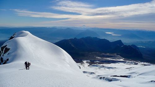 Scenic view of snow covered mountains against sky