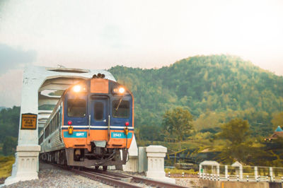 Train on railroad track against sky