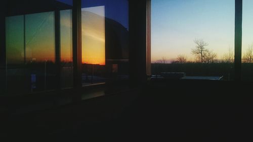Silhouette of building at sunset