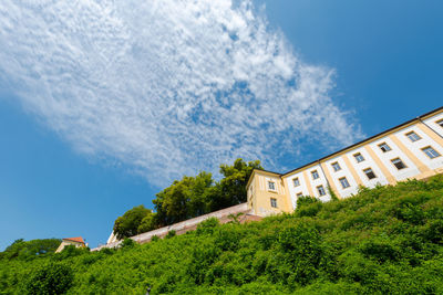 Low angle view of buildings against blue sky