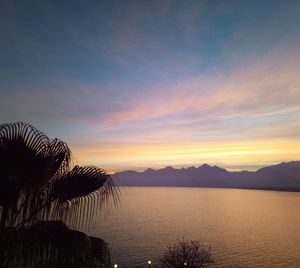 Scenic view of lake against sky during sunset