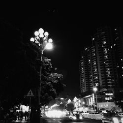 Illuminated city street at night