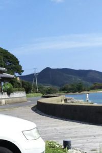 Surface level of empty road against mountain range