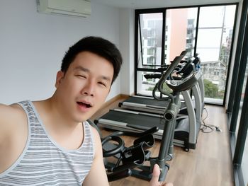 Portrait of man standing in gym