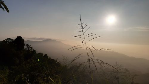 Scenic view of silhouette mountains against sky during sunset