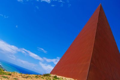 Low angle view of built structure against blue sky