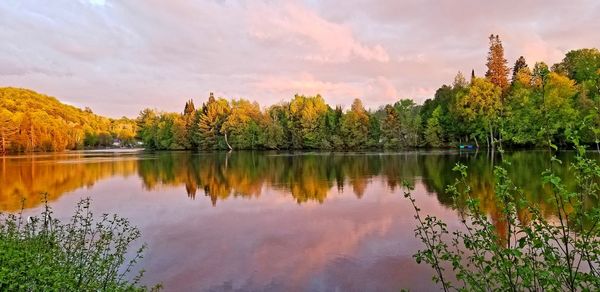 Scenic view of lake against sky during autumn