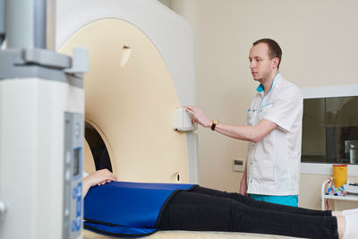 Doctor preparing patient for mri