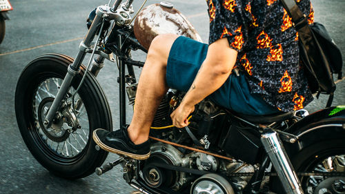 Low section of man cycling on bicycle