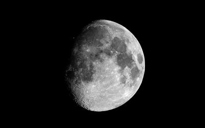 Low angle view of moon over black background