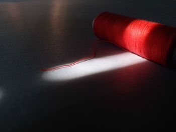 Close-up of red light bulbs on table