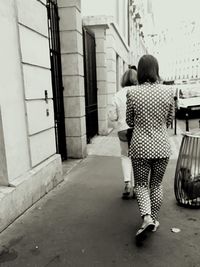 Full length of woman standing in city