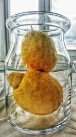 Close-up of eggs in glass jar on table