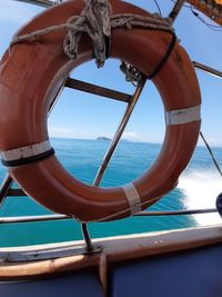Low angle view of ship on sea against sky