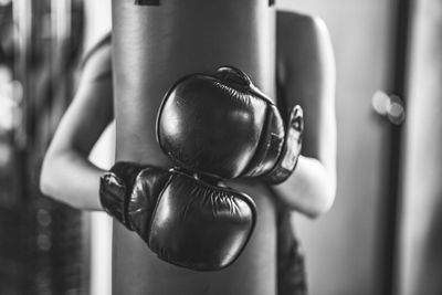 Young woman practicing boxing in gym