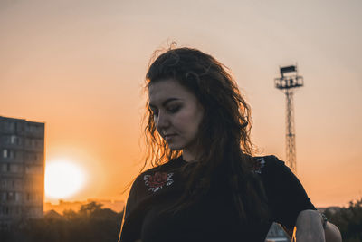 Woman looking at sunset
