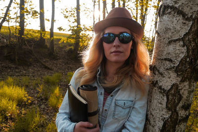 Portrait of young woman in sunglasses