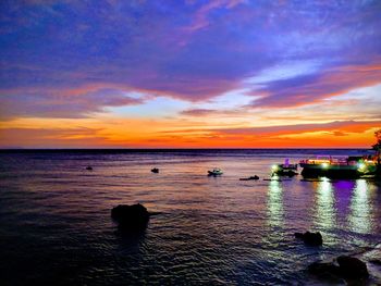 Scenic view of sea against sky at sunset