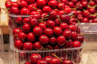 Group of red cherries in a basket for sale