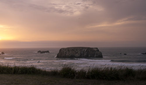 Scenic view of sea against sky during sunset