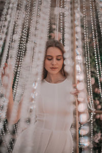 Woman under illuminated decoration