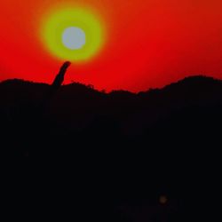 Silhouette landscape against sky during sunset